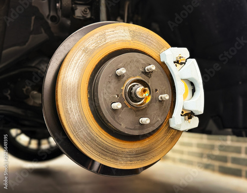 Fotografi Car ventilated front brake disc with caliper