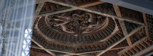 Slika na platnu Exquisite Dragon Wood Carvings on Ancient Beijing Ceiling Canopies