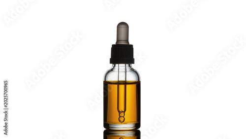 Photos Clear glass dropper bottle with amber liquid, isolated on transparent background