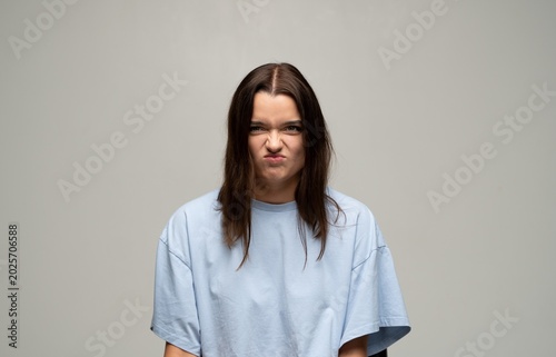 Photography Young woman showing frustration, disgust, and annoyance with a sulking facial ex