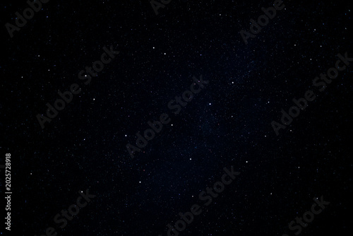 Tableau sur toile Beautiful starry night sky filled with countless bright stars and a faint hint of the Milky Way galaxy