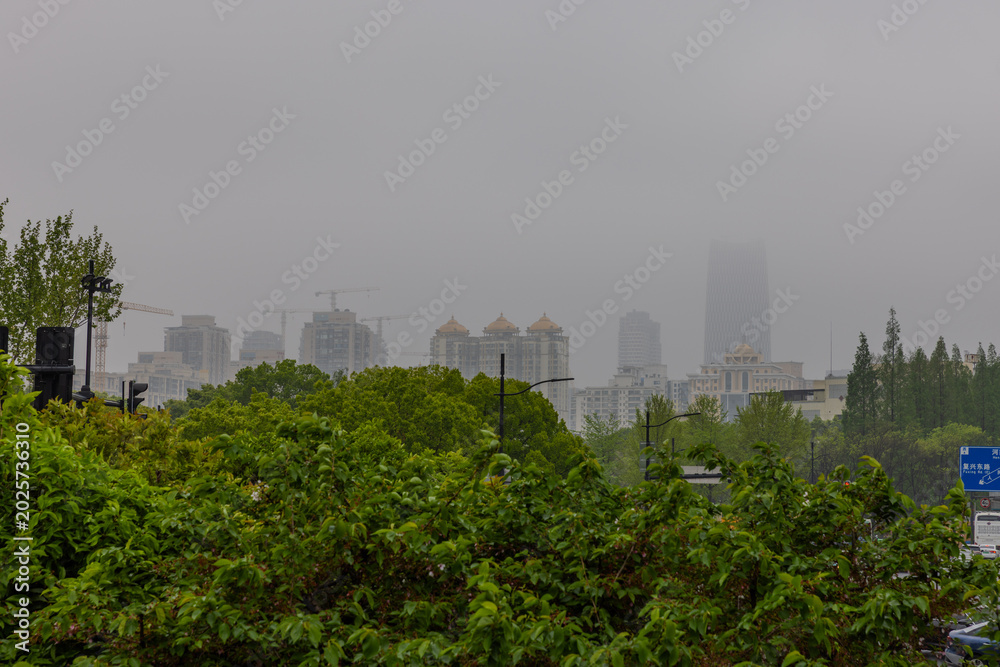 Fototapeta premium 18 April 2026 Fog low clouds surrounding the Buildings over Shanghai the Bund in China with the highrise towers on the Huangpu River