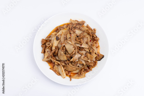 Stir-fried meat with shiitake mushrooms on the plate