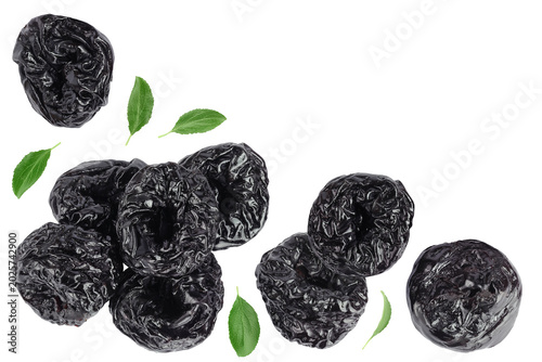 Prunes isolated on white background, heap of dried plums. Top view. Flat lay