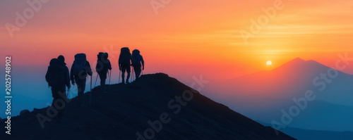 Group hiker mountain summit sunrise silhouette outdoor adventure team reaching peak ridge dawn, hiking trail scene with backpacks, trekking pole