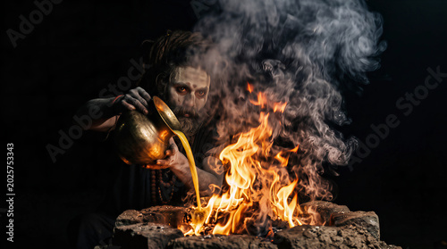 Aghori Sadhu Performing Intense Fire Ritual 
in Darkness, Hands Over Sacred Flames, Hindu 
Tantric Ceremony Mystical Art