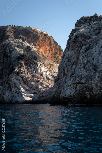 Vertical View of Steep Rocky Cliffs and Sea in Alanya Turkey