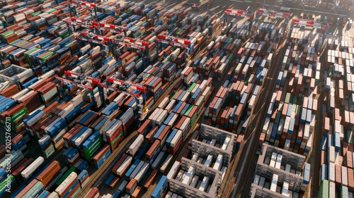 Drone view of shipping containers in a busy industrial port