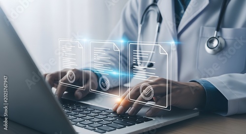 Doctor interacting with electronic health records on a laptop