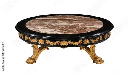 Quadro su tela Ornate round black table with marble top and gilded floral carvings, isolated on