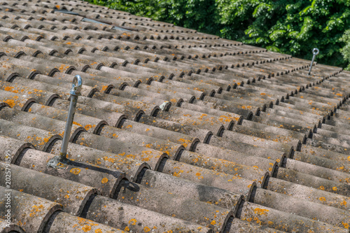 Fotografia Two inclined anchor points were installed on a pitched tile roof