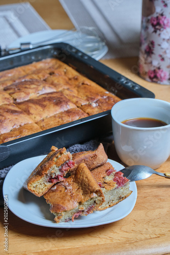 Delicious crumb cake with berries and fruit topping. Homestyle berry dessert featuring fresh berries on rustic table scene