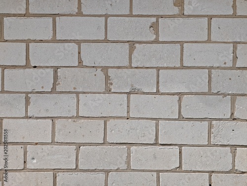Schilderij op canvas Textured rustic white silicate brick wall background close-up