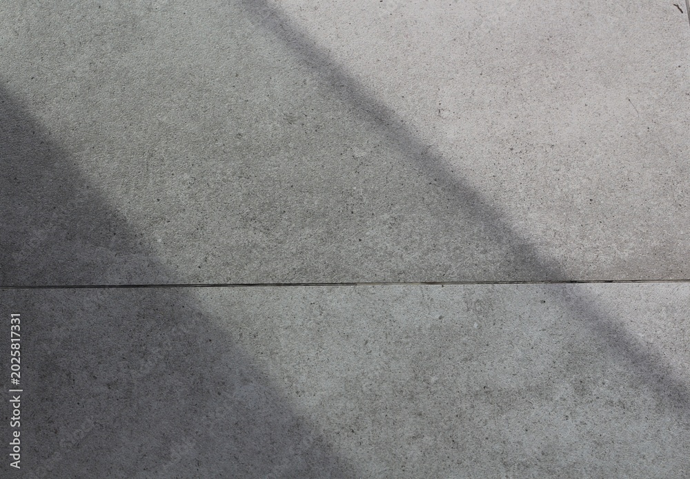 Fototapeta premium Abstract concrete surface with light and shadow play
