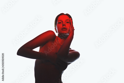 Photos Photo of young authentic woman in red light wearing lingerie