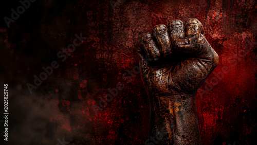 Powerful rusty iron fist emerging dramatically from dark red grunge background