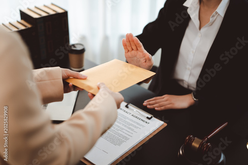 Obraz na plátně Person refusing a bribe, rejecting an envelope with illicit money, emphasizing i