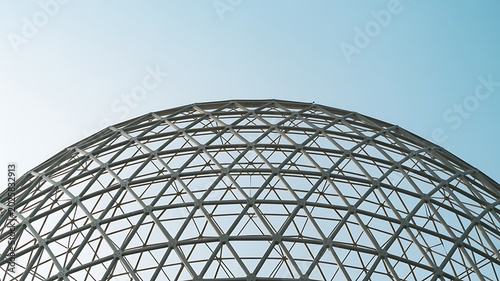 Large metal dome structure with blue sky
