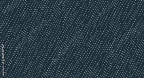 Abstract background pattern of many white diagonal lines representing rainfall against a dark navy blue night sky or backdrop.