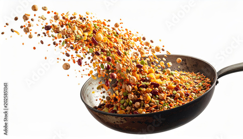 Dynamic explosion of mixed pulse lentil and chickpea grain bursting upward in motion