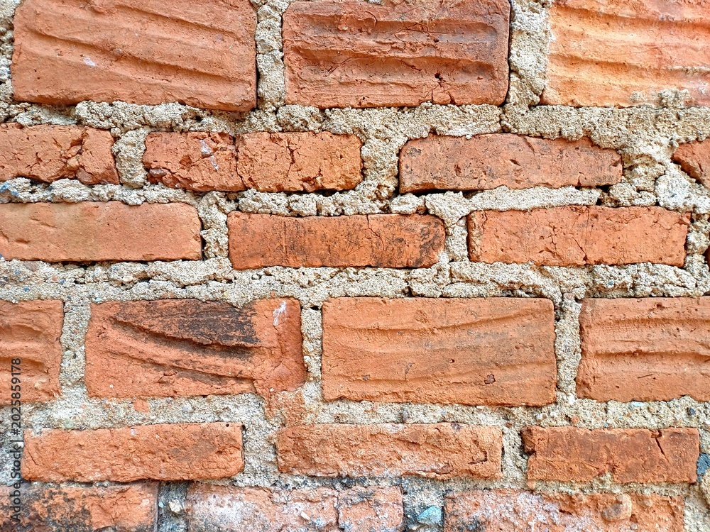 Obraz premium Red brick textures. Red soil brick wall textures. Rustic Brick Wall background. Grunge Red Brick Wall Surface Design. Vintage Soil Brick Wall Texture Graphic