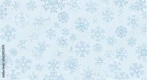 Canvastavla Seamless winter background pattern features numerous intricate blue snowflakes on a light blue vertically striped backdrop