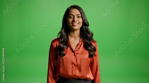 Woman in Red Blouse Smiling and Gesturing on Green Screen