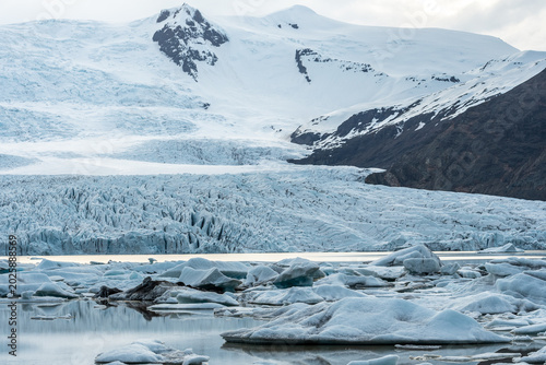 Glacier lagoon with icebergs floating at the foot of the Vatnajokull Glacier or Vatna Glacier, the largest and most voluminous ice cap in Iceland, and the second largest in area in Europe