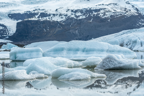 Glacier lagoon with icebergs floating at the foot of the Vatnajokull Glacier or Vatna Glacier, the largest and most voluminous ice cap in Iceland, and the second largest in area in Europe