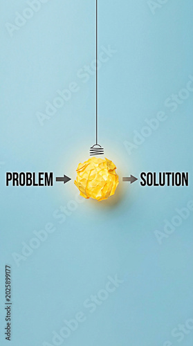 Crumpled paper light bulb representing a creative solution process in this conceptual and bright studio photo