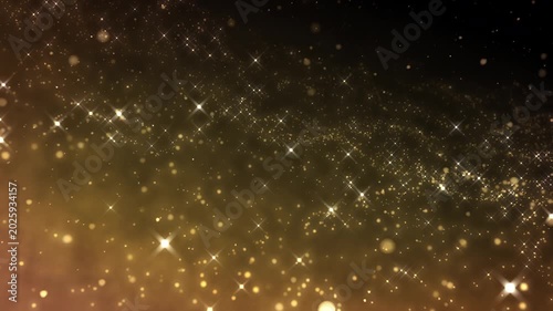 Golden glitter particles dust powder shining stars abstract background