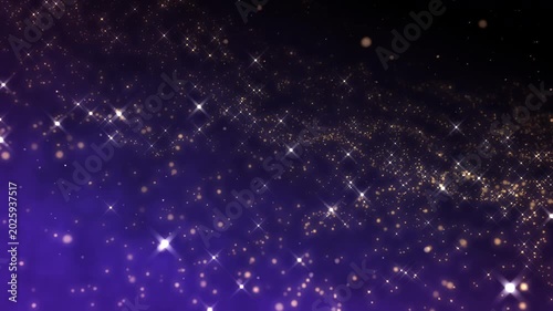 Golden glitter particles dust powder shining stars abstract blue background