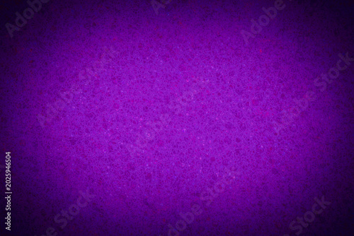 violet backdrop with illuminated center: close up of sponge texture