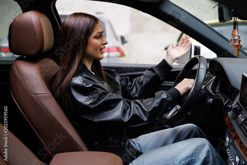 Photography Beautiful woman beep in the car in panic with closed eyes while driving on high speed