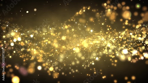 Golden glitter particles dust powder shining stars abstract background