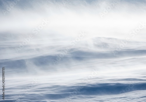 Severe winter blizzard creating a dramatic whiteout landscape with swirling flakes and intense wind conditions, dangerous, flurry, climate