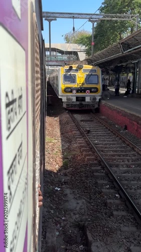 Mumbai Local Train Entering Mahim Junction Railway Station, India