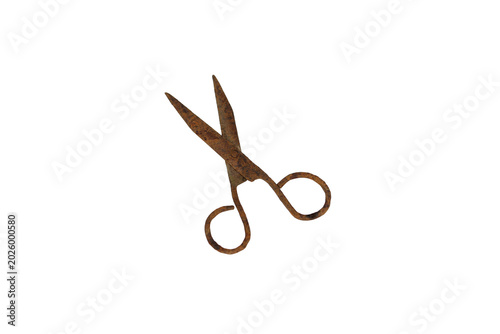Antique rusty scissors isolated on a white background, showing signs of age and wear