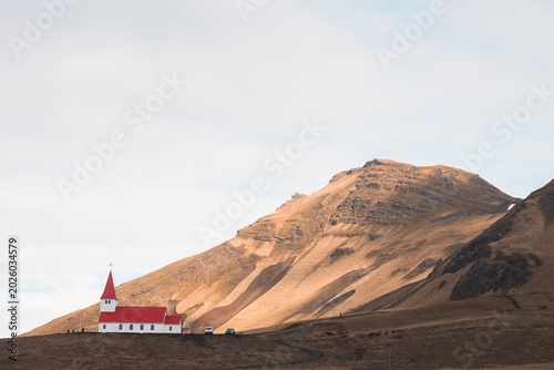 Icelandic church under mountain in remote countryside