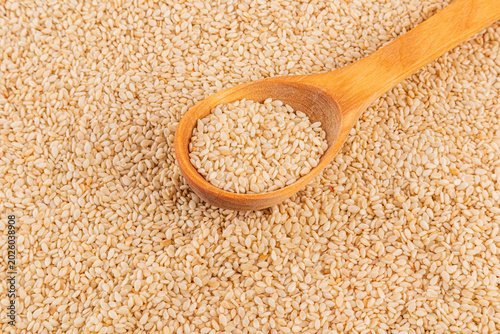 Close-up of sesame seed with wooden spoon, food texture