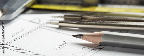 architectural blueprints with pencil, divider and ruler. Concept of industrial and real estate construction.