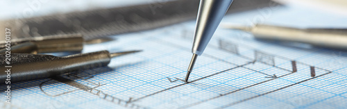 Tableau sur toile mechanical pencil makes a drawing on graph paper with ruler, dividers and tape measure