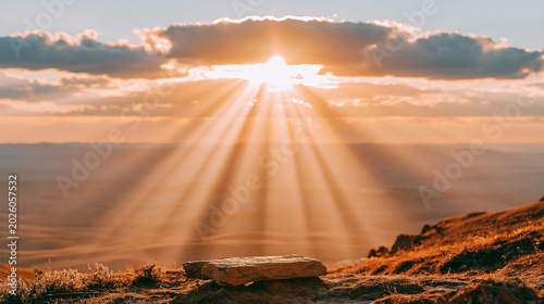 Sunbeams streaming through clouds over a mountain landscape with god rays, golden hour