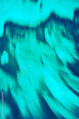 Abstract teal motion blur background with flowing streak