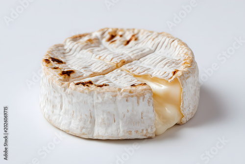 Classic Norman Camembert Cheese on White Background with Creamy Texture and Grilled Surface