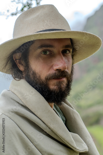 man in hat in outdoor background