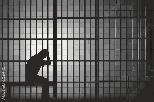 Schilderij op canvas prisoner silhouette in cell somber monochrome image