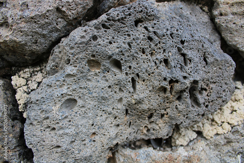 Fotografie Extreme macro close up of porous volcanic pumice stone texture