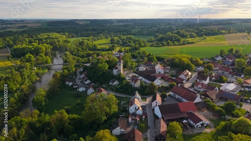 Drone aerial of Inkofen village in Freising district, Germany, capturing Schloss Inkofen, Catholic church and scenic Bavarian summer landscape.