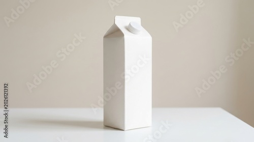 White milk carton beverage container on a white table surface with beverage container packaging